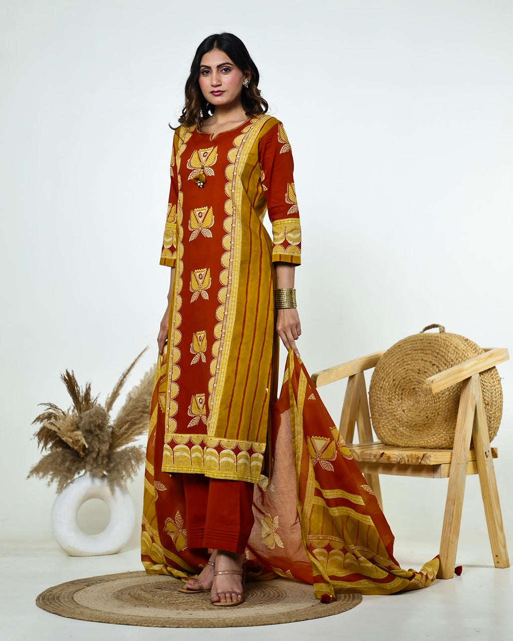 Navya-Rust Cotton Suit Set with Mustard Lotus Print, Mirror Work, Handwork Neckline & Tasselled Dupatta
