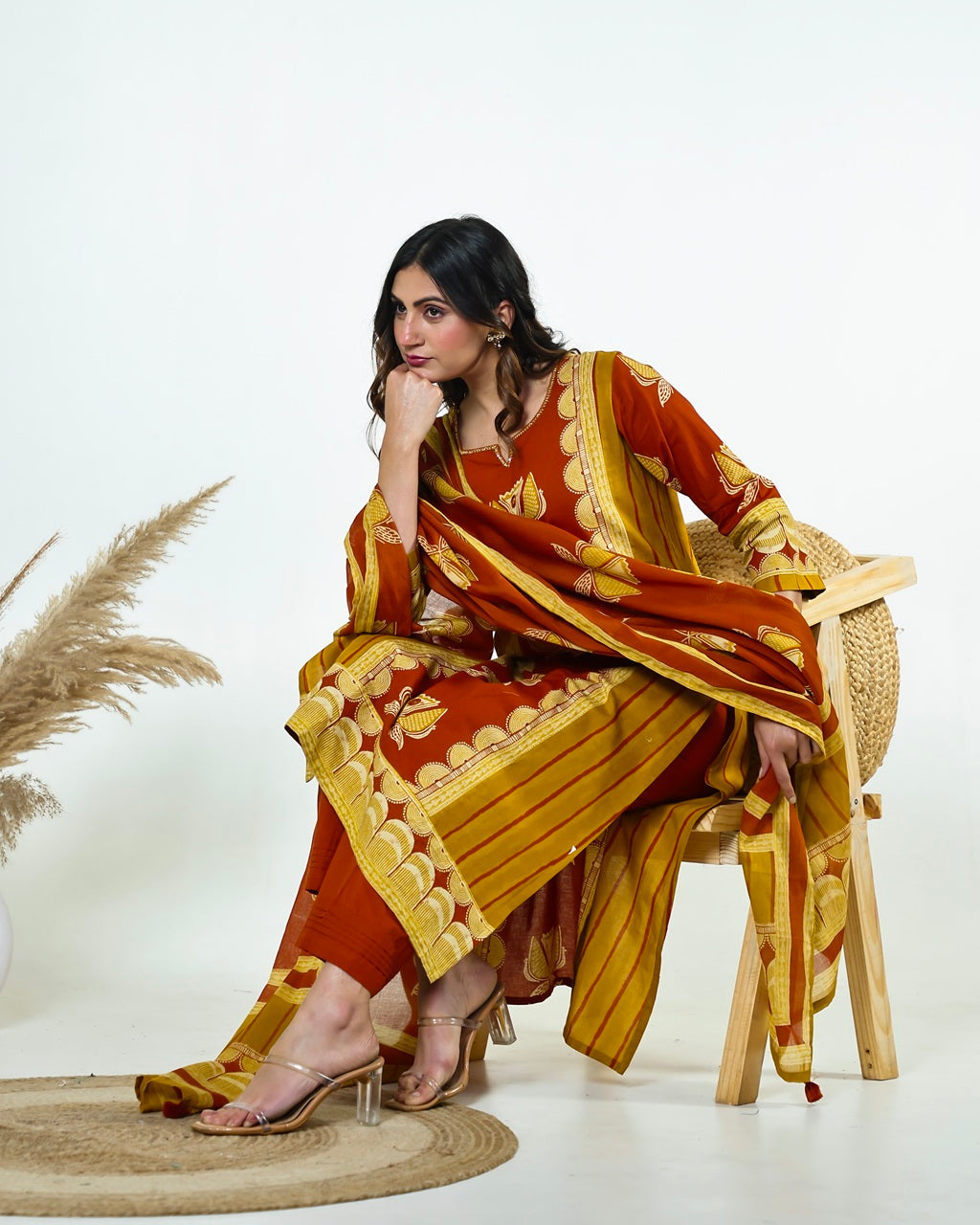 Navya-Rust Cotton Suit Set with Mustard Lotus Print, Mirror Work, Handwork Neckline & Tasselled Dupatta