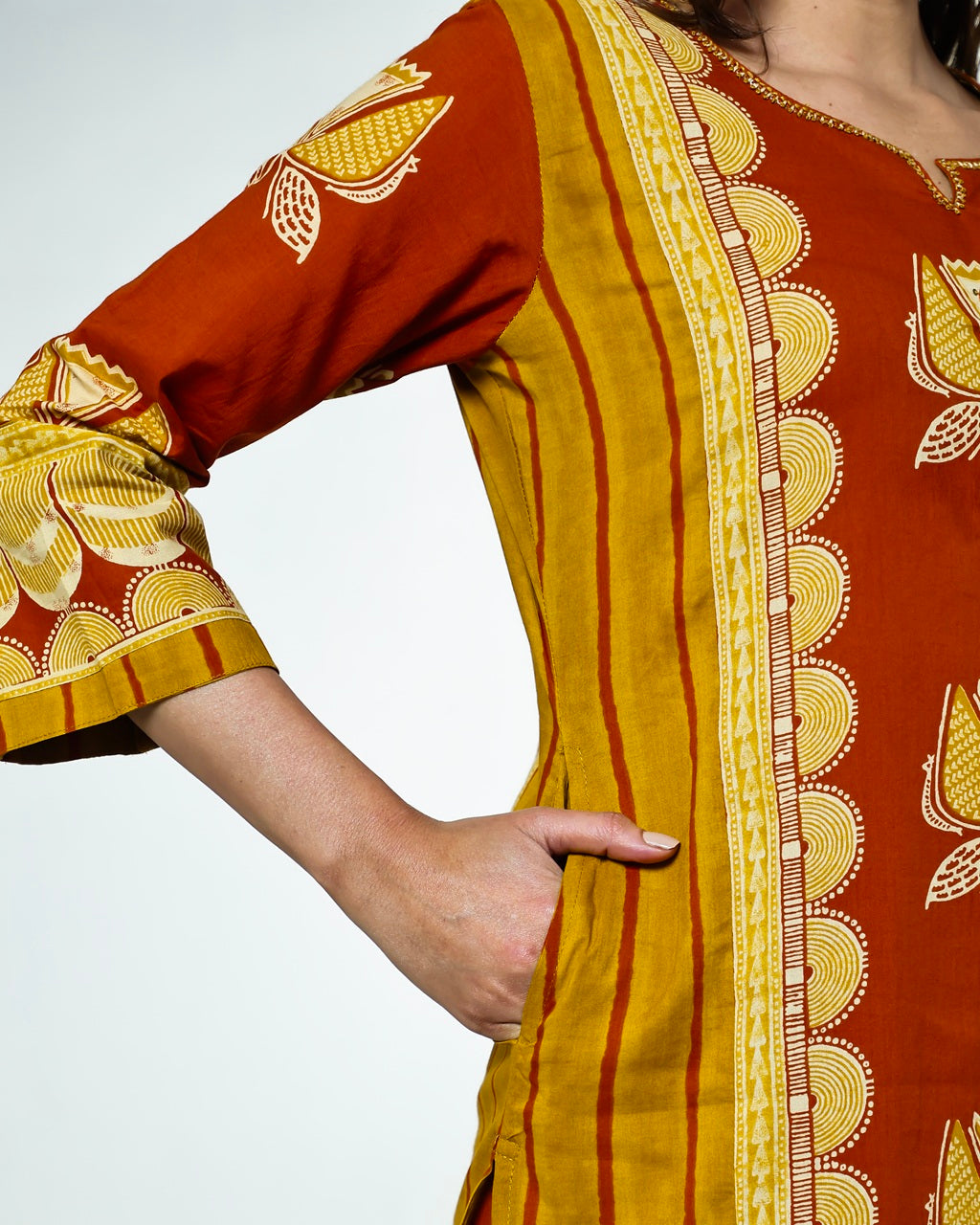 Navya-Rust Cotton Suit Set with Mustard Lotus Print, Mirror Work, Handwork Neckline & Tasselled Dupatta